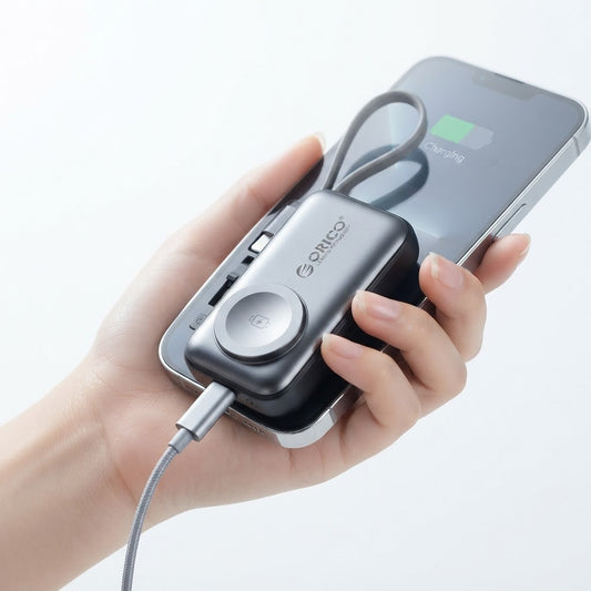 3-in-1 power bank on white background with its foldable AC plug extended and built-in USB-C cable visible.