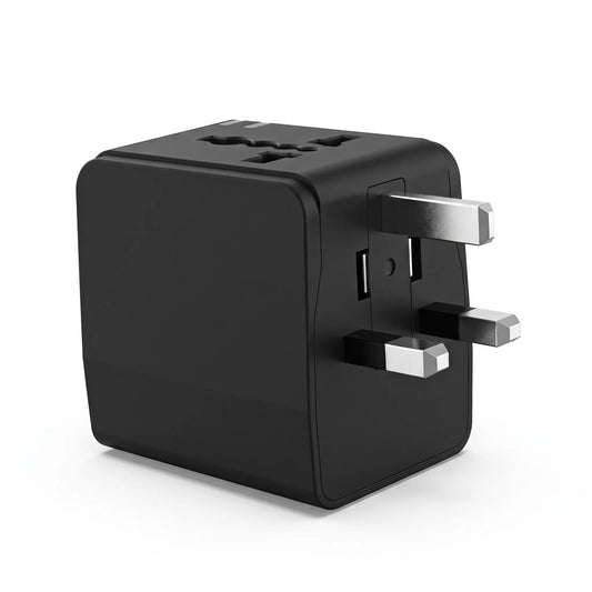 Close-up of universal adapter showing slide-out plug heads and AC outlets for different countries.